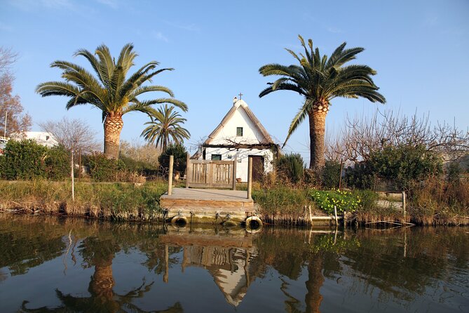 Albufera Private Day Tour: Paella, Boat Cruise and Nature Walk - Stop 2: Gola del Pujol—lake calm, a quiet walk, and traditional barracas