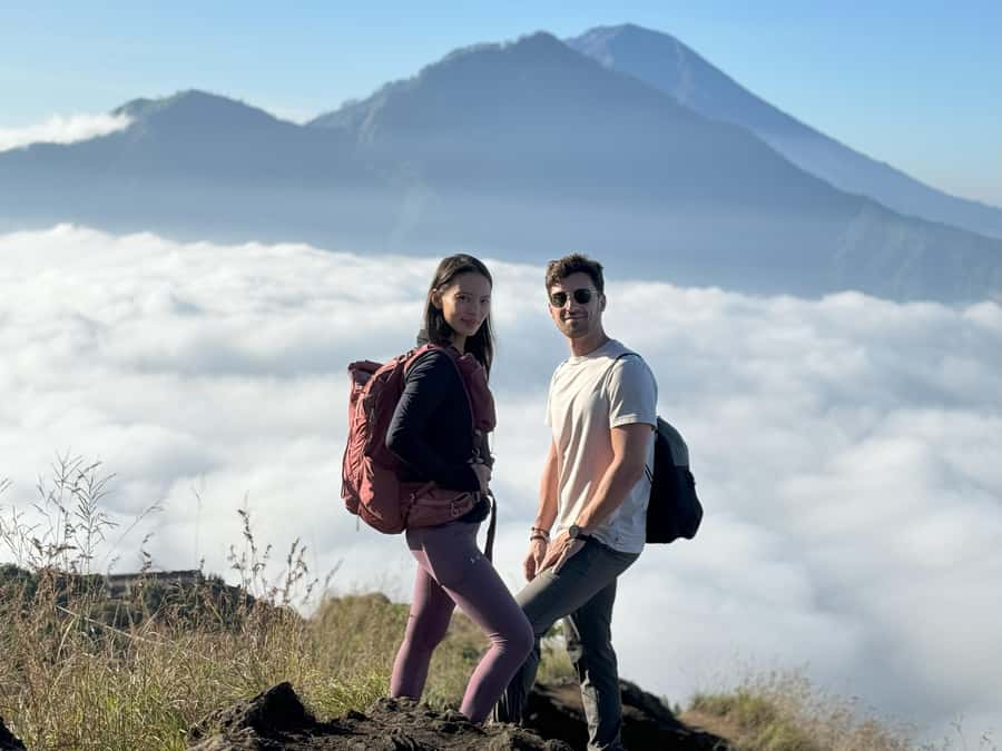 Bali: Mount Batur Guided Sunrise Trek with Breakfast - The volcanic loop descent: lava terrain, purple-bloom grass, and monkeys