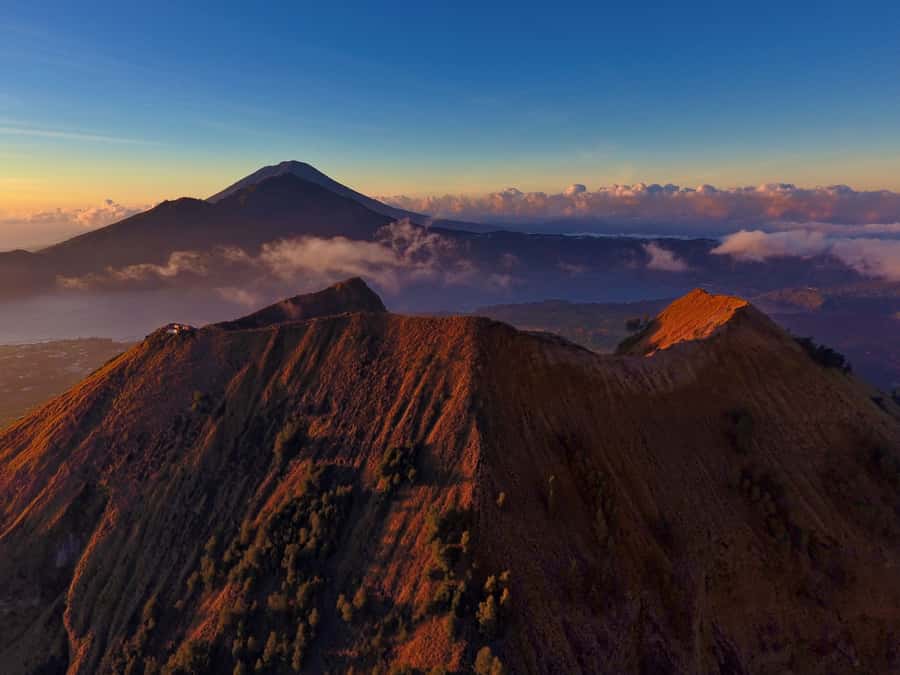 Bali: Mount Batur Sunset Trek with Picnic - The Climb Up Mount Batur: Poles, Volcanic Ground, and Big Views