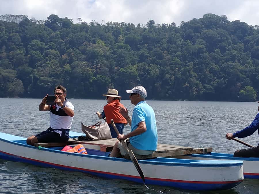 Bali: Munduk Waterfalls Trek, Twin Lakes and Temple Tour - Approaching the lake temple: rocks, banyan trees, and photos that work