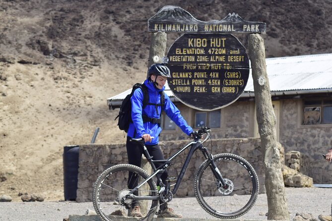 Best 5 Days Kilimanjaro Bike Trek Tour via Marangu Kilema Route - Day 4: 4:00 am zigzags, Hans Meyer’s Cave, Gilman’s Point, and the bike segment to Uhuru