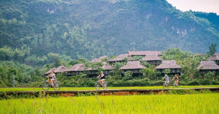 From Hanoi: Mai Chau Valley & Hill Tribes 2-Day Trek Tour - Day 1: photo stop views, a traditional lunch, then cycling with a private guide