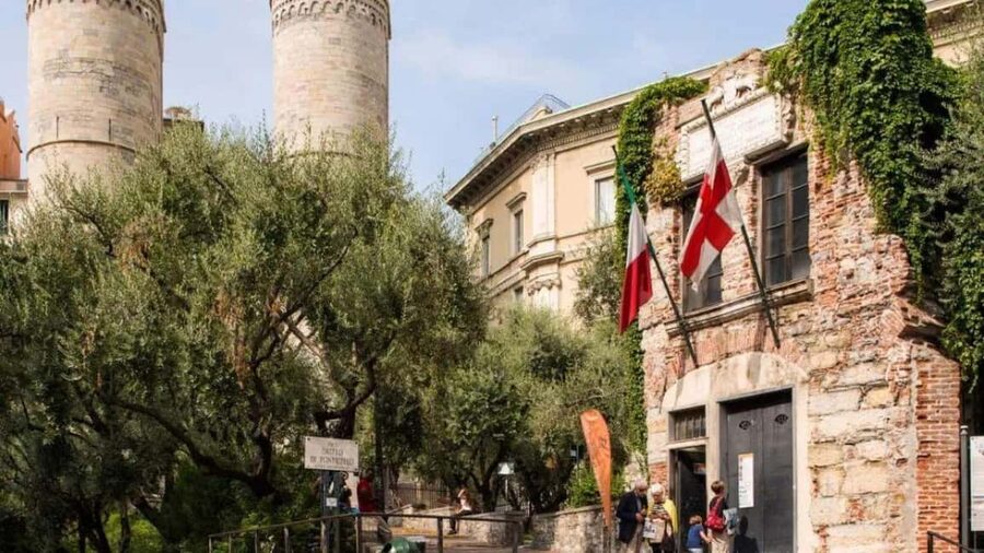 Genoa: Columbus Trail Urban Trekking with Wine & Local Tastings - Via di Ravecca to Palazzo San Giorgio: old streets, quick stops, real texture