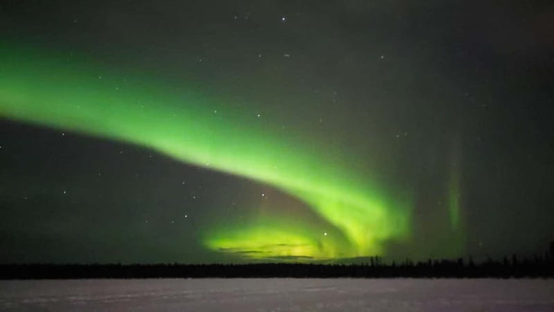 Kiruna: Snowshoe Trek with Aurora Hunt and Warm Beverage - Kitted out for the cold: snowshoes, poles, and real-world comfort