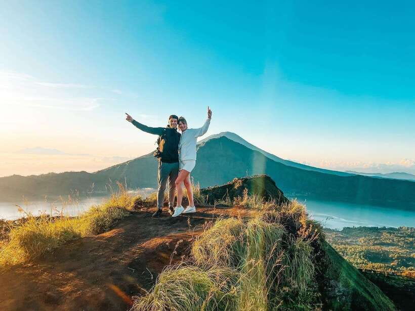 Mount Batur Sunset Trekking And Natural Hot Spring Tour - At the summit: dinner, hot drinks, and the sunset timing payoff