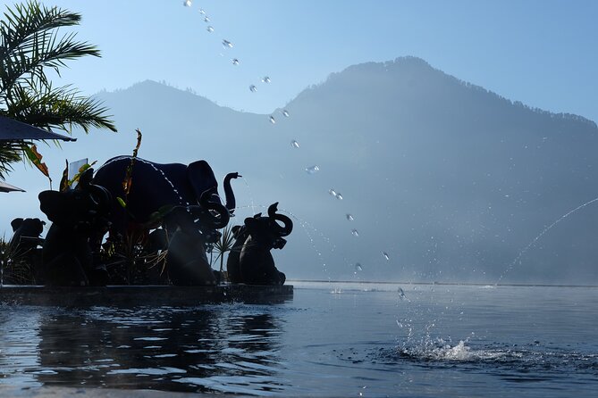Mount Batur Volcano - Sunrise Trekking with White Water Rafting - On-the-water scenery: the fun comes with waterfalls and shrines