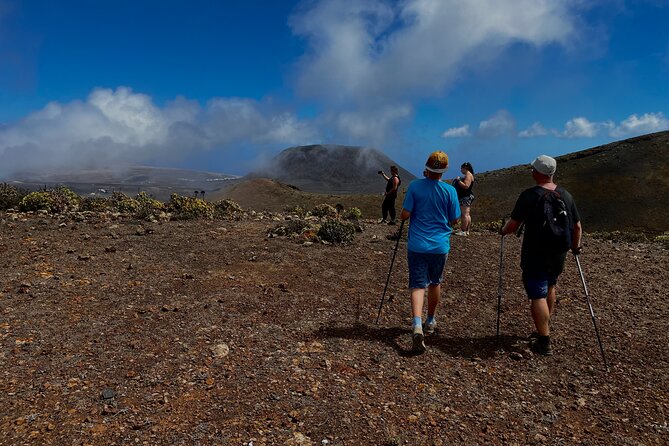 North Volcano Trekking Tour - La Corona climb: vineyards, crater scale, and the volcanic tunnel