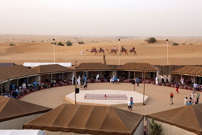 Sunset Camel Trek & Red Dunes Safari with BBQ at Al Khayma Camp From Dubai - Red Dunes Camp Arrival: Majilis Seating, Coffee and Dates, and Falcon Photos