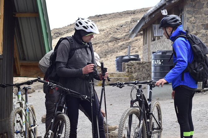Top 6 Days Mt. Kilimanjaro Bike trek Tour by Marangu-Kilema Route - Day 5: 4:00 am zigzags, Hans Meyer’s Cave, Gilman’s Point, then riding to Uhuru Peak