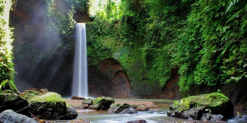 Ubud: Rice Terrace, Holy Water Temple & Waterfalls Trek Tour - Kanto Lampo Waterfall: Tiered Cascades and Photo-Friendly Footwork