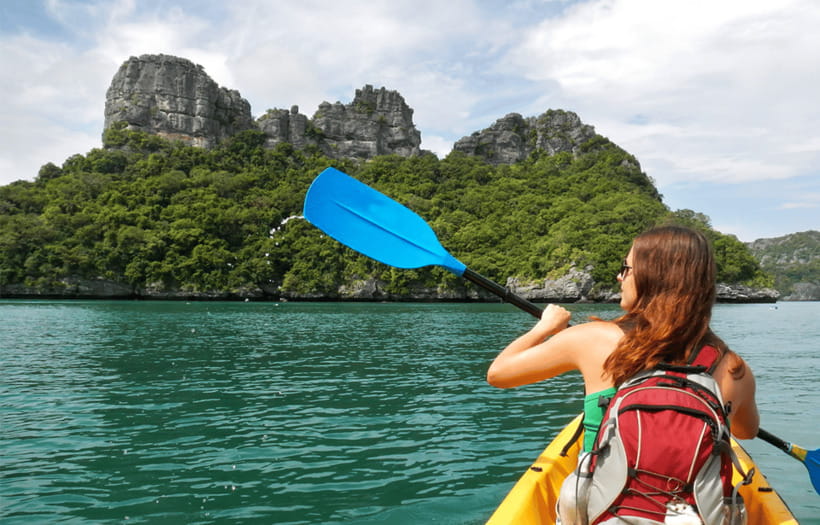 Vang Vieng: Day Tour with Kayaking, Ziplining, and Rafting - Ziplining in the jungle: how the safety briefing changes the experience